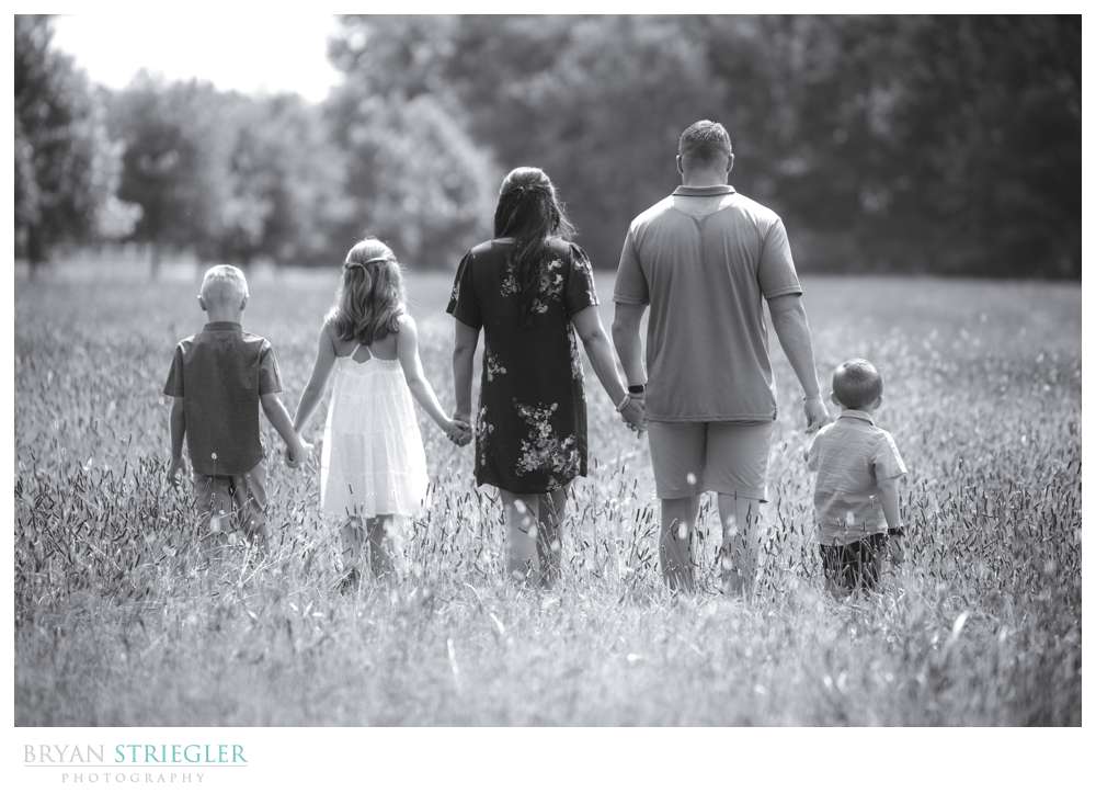 family walking holding hands